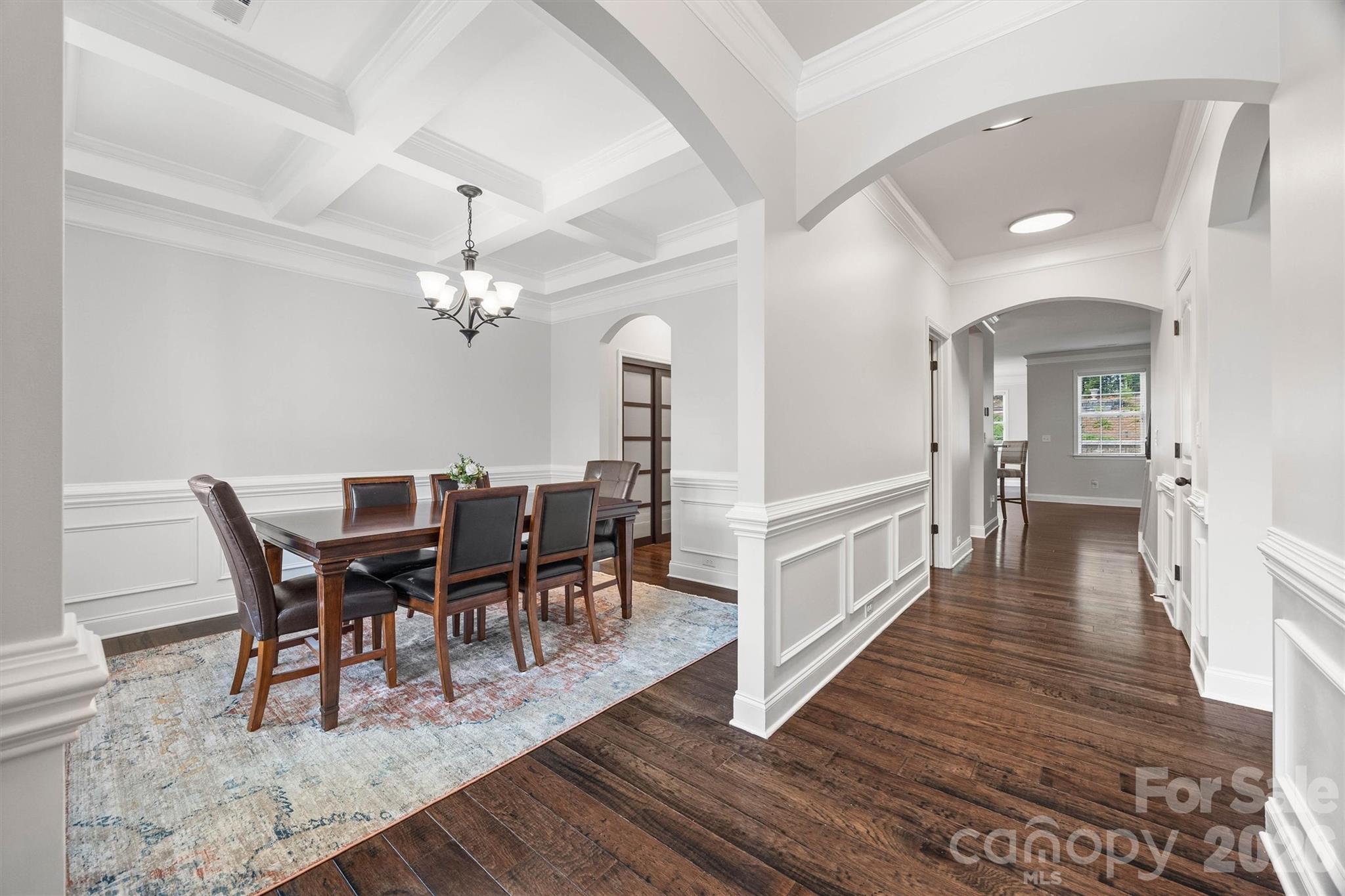 299 Annatto Way Tega Cay, SC 29708 - Photo 5 of 46 a view of a dining room with furniture and wooden floor