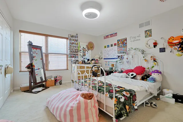 a bedroom with furniture a bed and a window