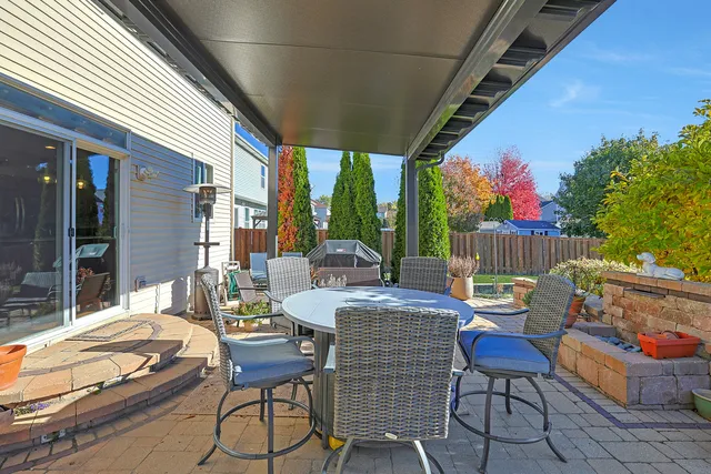a outdoor space with patio couch and chairs