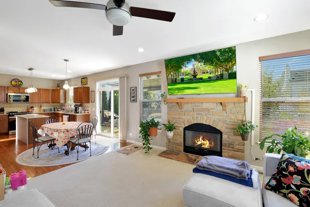 a living room with furniture fireplace and flat screen tv