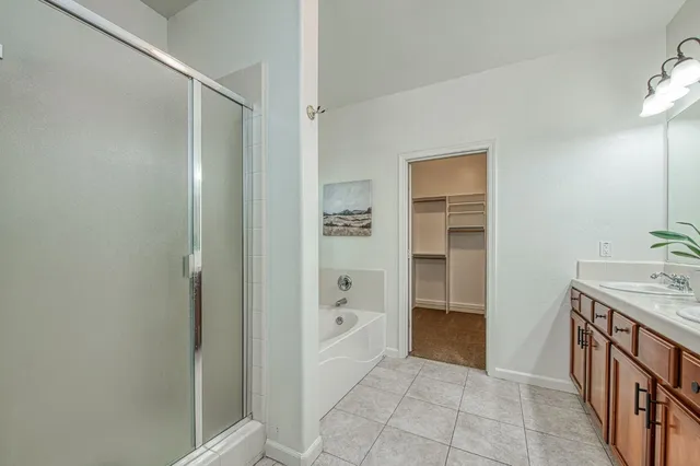 a bathroom with a bathtub and a sink