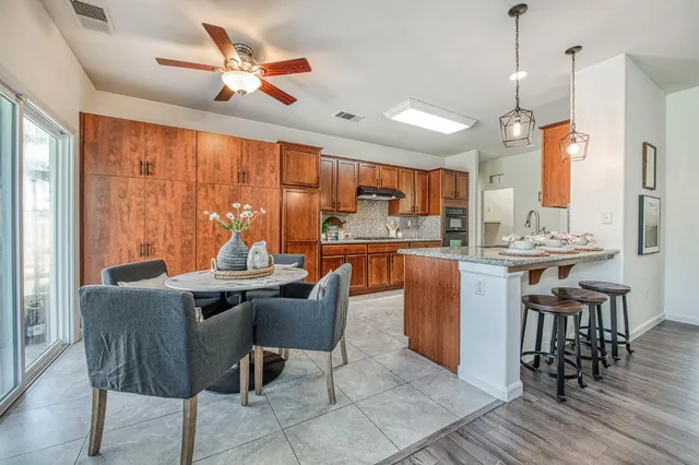 a dining room with furniture a chandelier