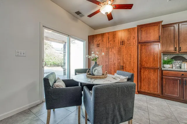 a view of a dining room with furniture window and outside view