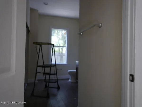 a view of entryway with wooden floor