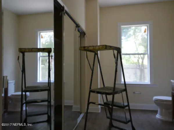 a view of a room with furniture window and wooden floor