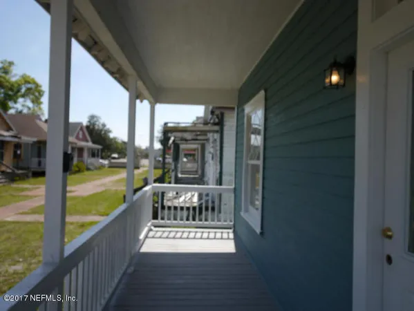 a view of balcony with furniture