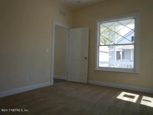 an empty room with windows