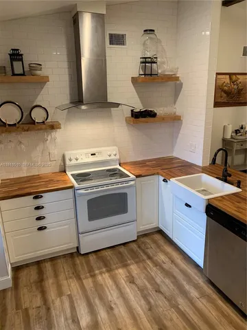 a kitchen with a stove and a sink