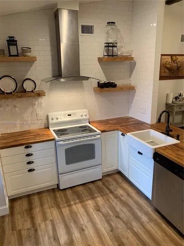 a kitchen with a stove and a sink