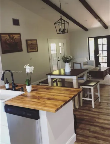 a kitchen with stainless steel appliances granite countertop a sink and stove