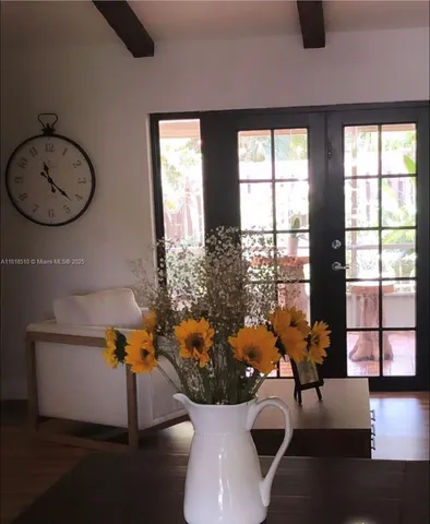 a view of living room with furniture and a large window