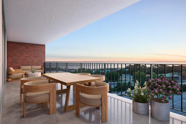 a terrace with outdoor seating city view and a potted plant