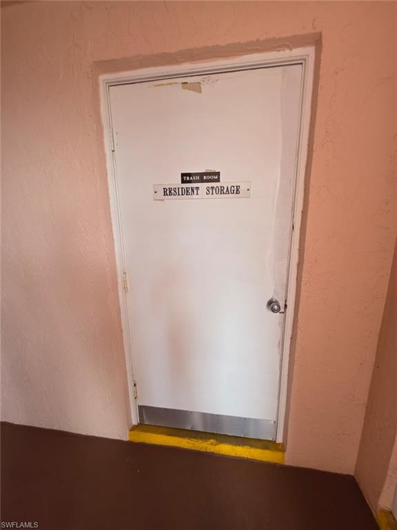 160 Turtle Lake Court, Unit 209 Naples, FL 34105 - Photo 16 of 26 a bathroom with a glass shower door