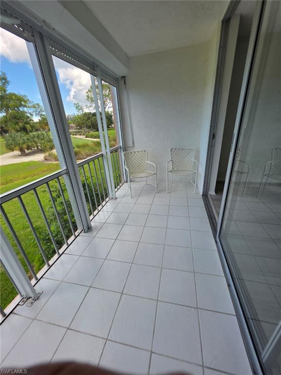 160 Turtle Lake Court, Unit 209 Naples, FL 34105 - Photo 18 of 26 a view of an outdoor space with a large window
