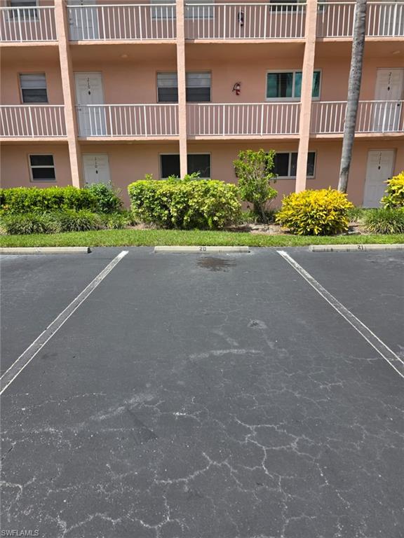 160 Turtle Lake Court, Unit 209 Naples, FL 34105 - Photo 2 of 26 a view of a street with a building in front of it