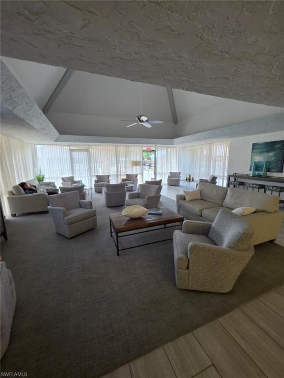 160 Turtle Lake Court, Unit 209 Naples, FL 34105 - Photo 24 of 26 a living room with furniture and a flat screen tv