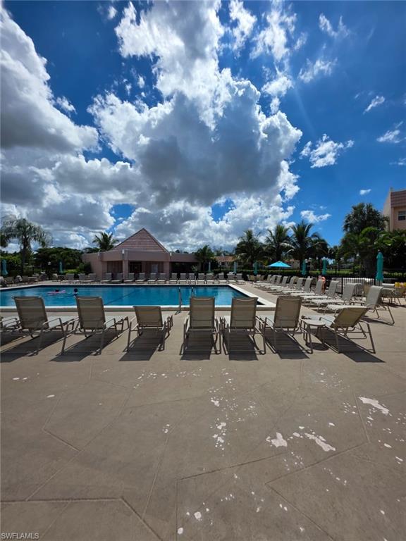 160 Turtle Lake Court, Unit 209 Naples, FL 34105 - Photo 25 of 26 a view of a terrace with sitting area