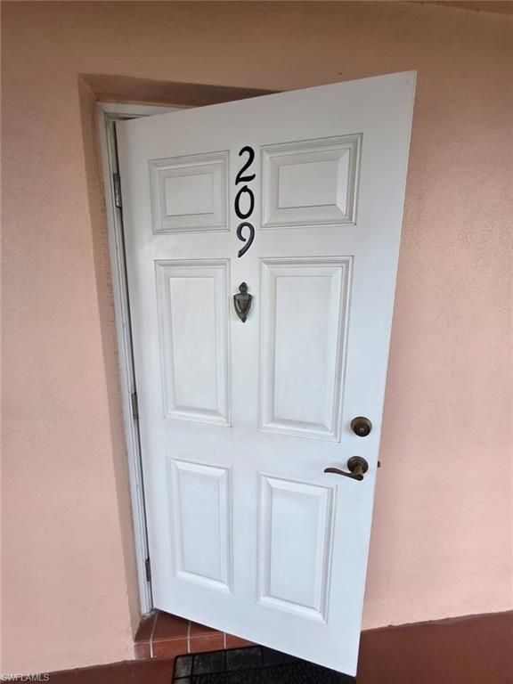 160 Turtle Lake Court, Unit 209 Naples, FL 34105 - Photo 3 of 26 view of door with door