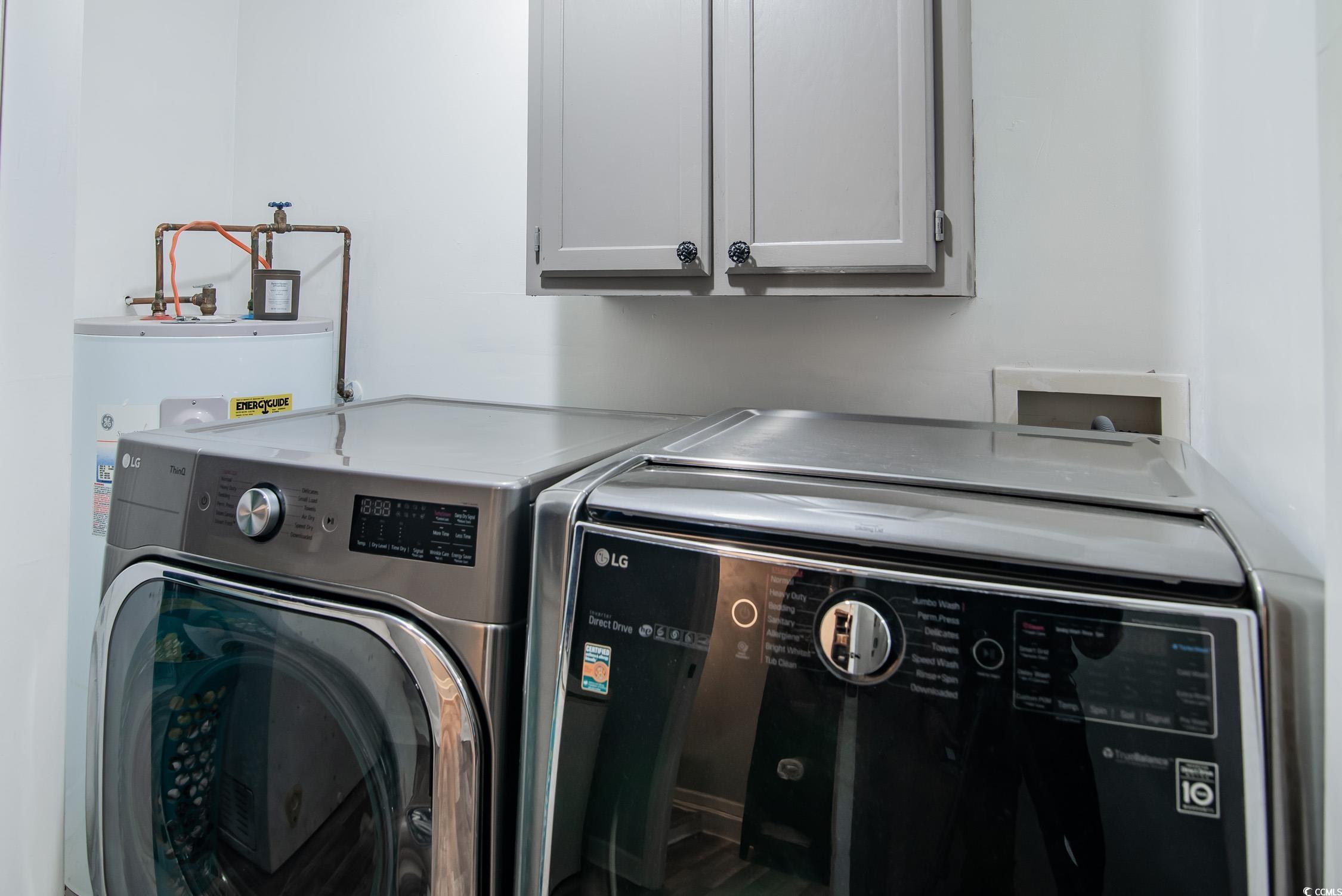 2510 Redwood Street Georgetown, SC 29440 - Photo 20 of 27 Bedroom featuring light wood-style flooring, a textured ceiling, baseboards, ceiling fan, and washer / clothes dryer