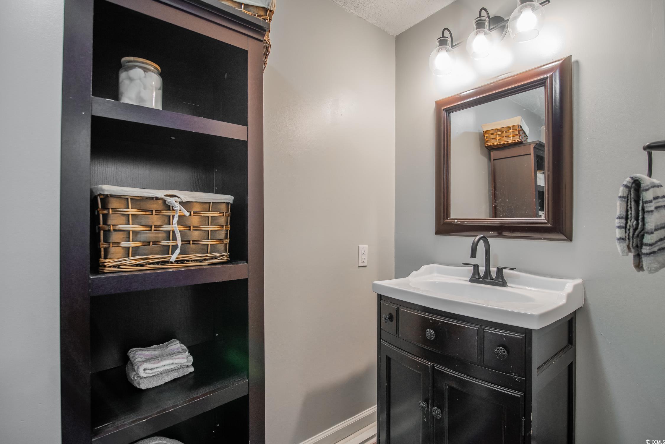 2510 Redwood Street Georgetown, SC 29440 - Photo 21 of 27 Laundry room with independent washer and dryer and cabinet space