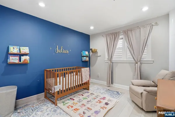 a bedroom with furniture and a rug