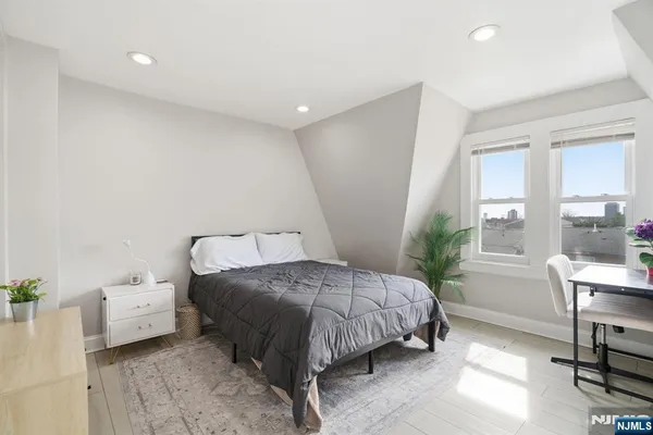 a bedroom with a bed and a table
