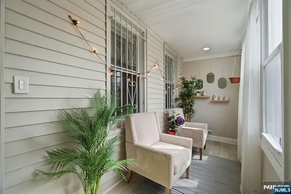 a view of a house with a potted plant and a window