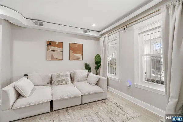 a living room with furniture and a window