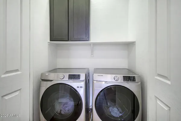 a utility room with dryer and washer