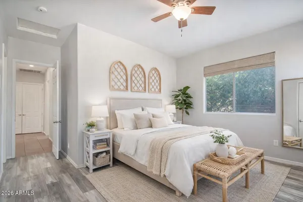 a bedroom with a bed and a window