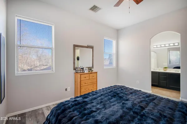 a bedroom with a bed and a dresser