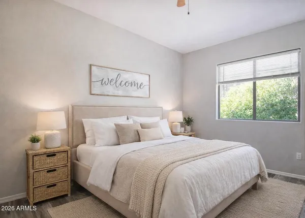 a bedroom with a bed and a window