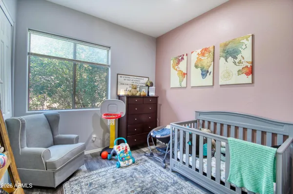 a bedroom with furniture and a window