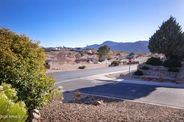 a view of a street with a mountain