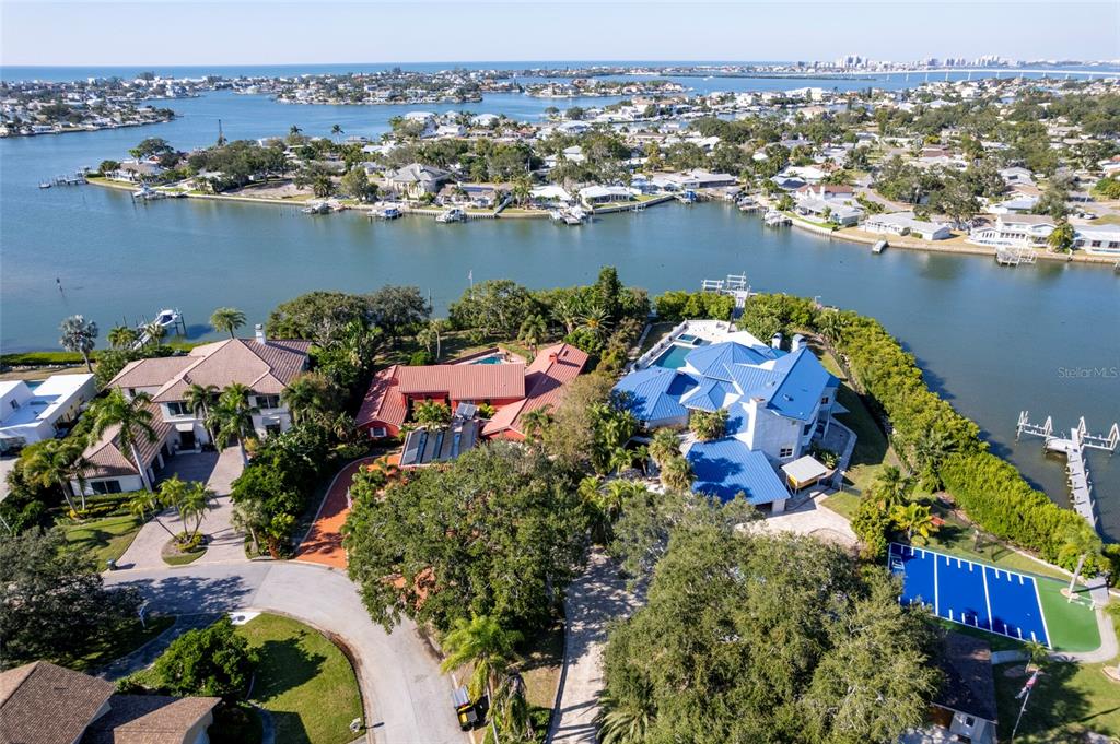 an aerial view of lake and houses with outdoor space