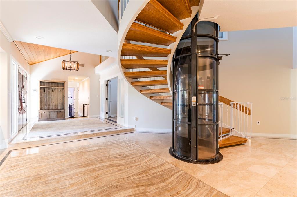 2268 Kings Point Drive Largo, FL 33774 - Photo 13 of 84 a view of entryway and hall with wooden floor