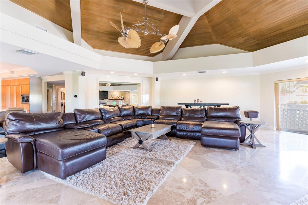 2268 Kings Point Drive Largo, FL 33774 - Photo 30 of 84 a living room with furniture and wooden floor