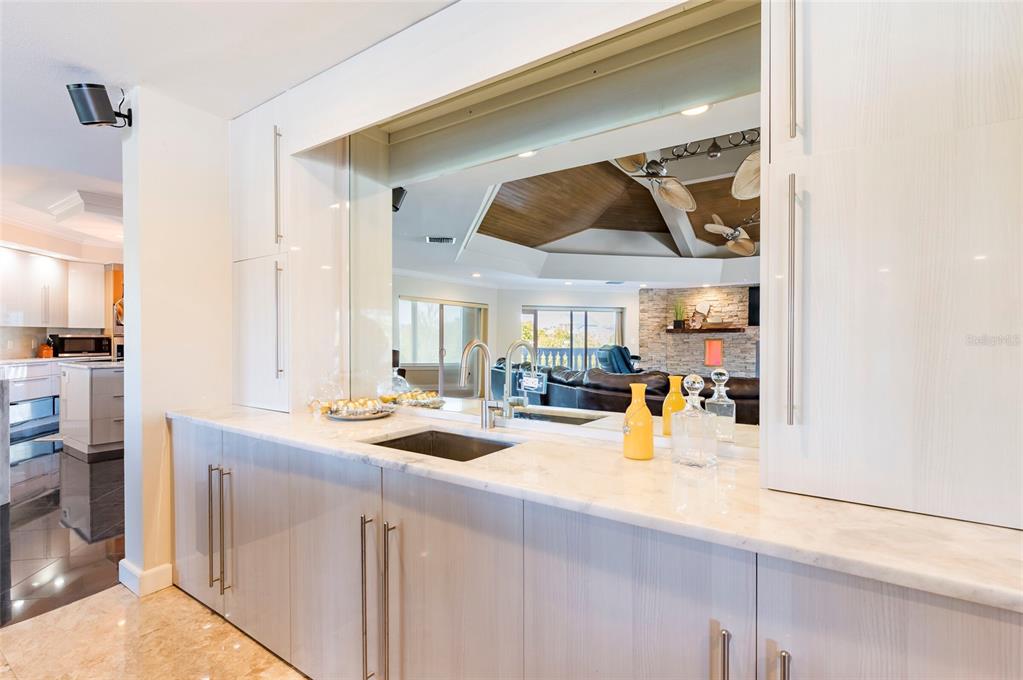 2268 Kings Point Drive Largo, FL 33774 - Photo 34 of 84 a kitchen with a sink and cabinets