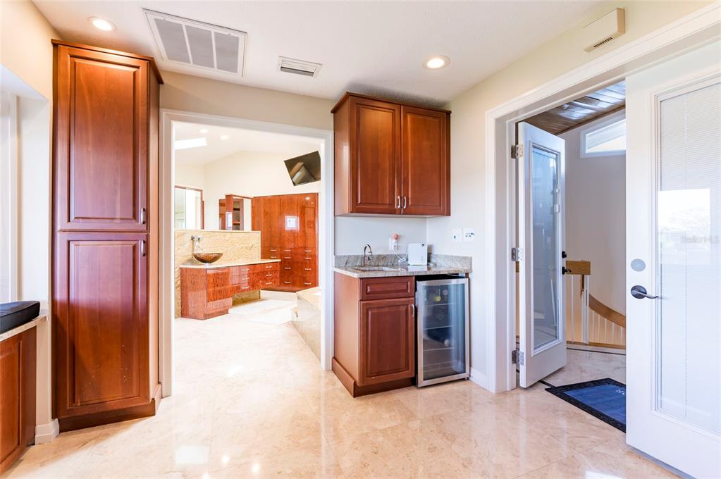 2268 Kings Point Drive Largo, FL 33774 - Photo 43 of 84 a view of kitchen with stainless steel appliances granite countertop a refrigerator and a sink