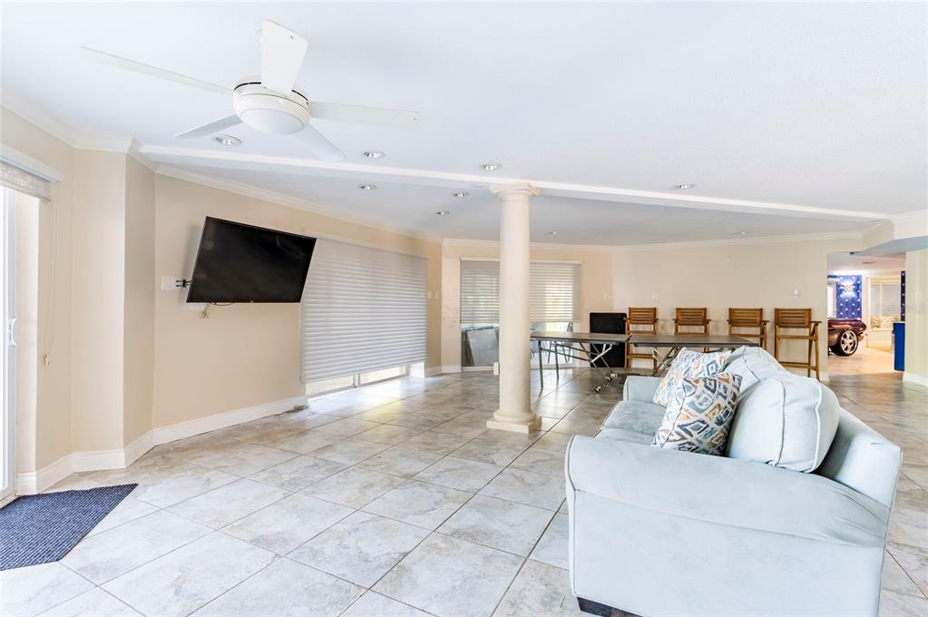 2268 Kings Point Drive Largo, FL 33774 - Photo 49 of 84 a living room with furniture and a flat screen tv