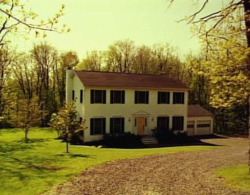 8 Brick School Road Warren, CT 06754 - Photo 1 of 1 a front view of a house with a yard