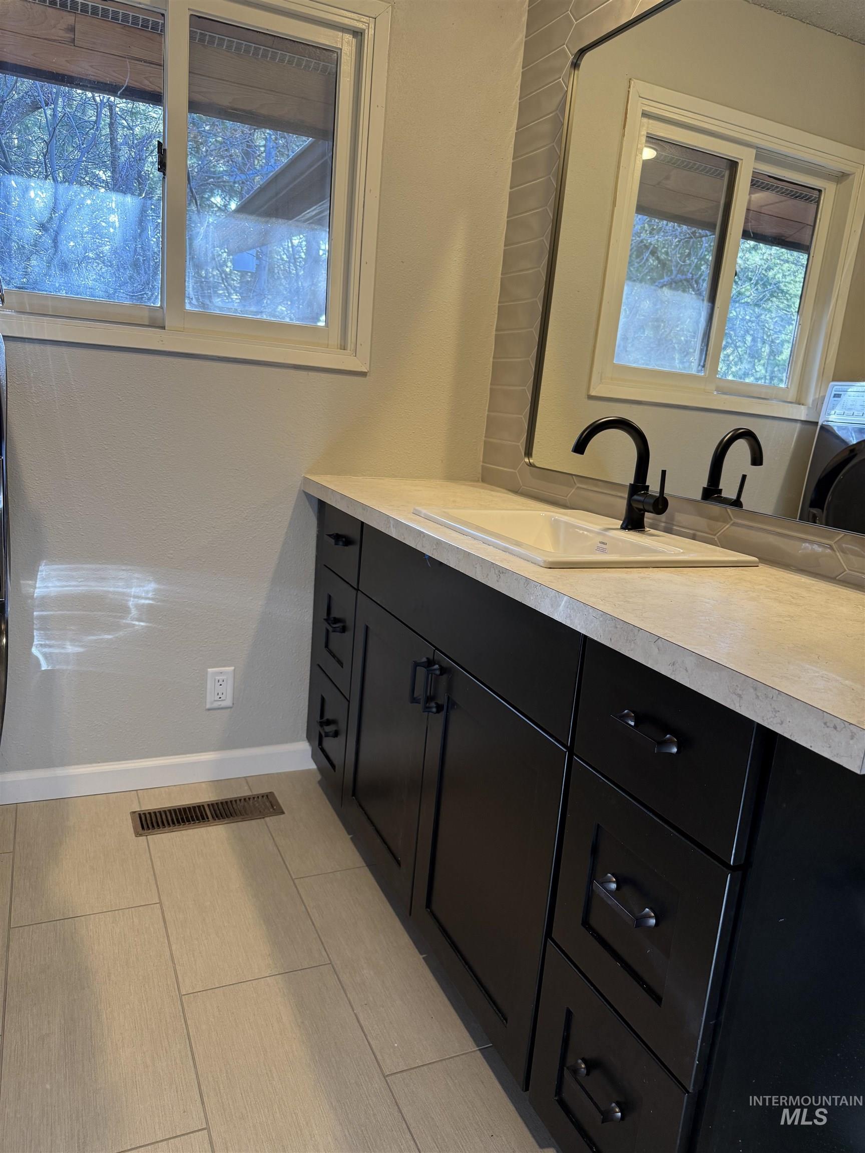 1050 Paradise Ridge Road Moscow, ID 83843 - Photo 13 of 49 Bathroom featuring vanity and washer / dryer