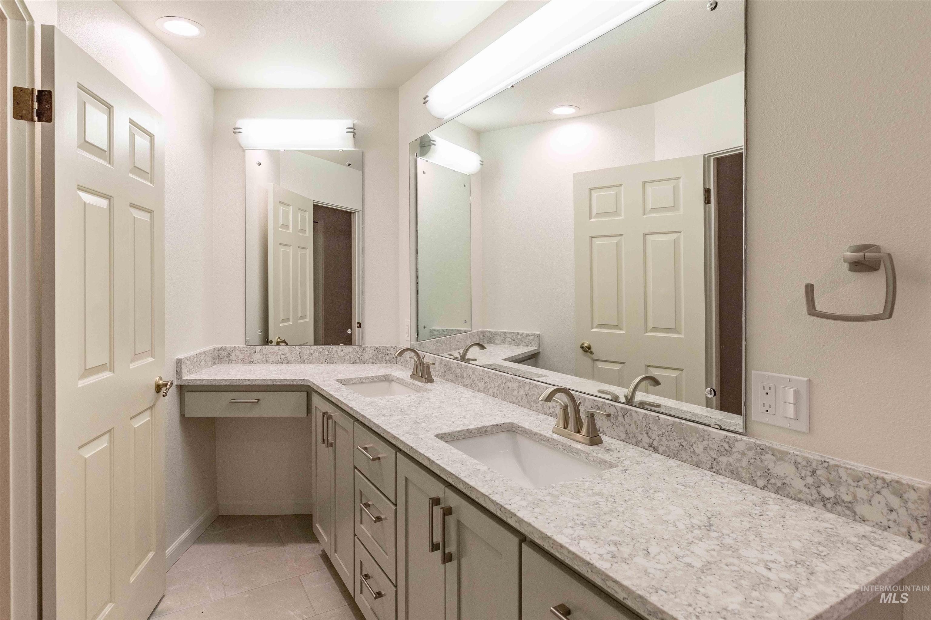 1050 Paradise Ridge Road Moscow, ID 83843 - Photo 20 of 49 Full bathroom featuring double vanity, recessed lighting, and light tile patterned floors