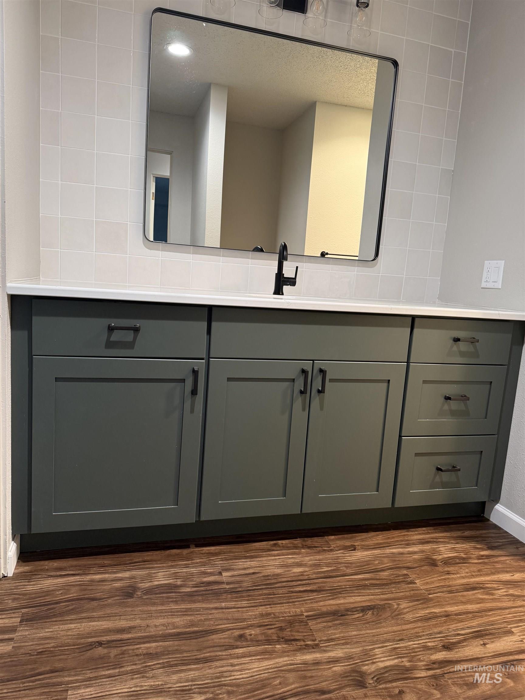 1050 Paradise Ridge Road Moscow, ID 83843 - Photo 29 of 49 Bathroom featuring vanity and dark wood-style flooring