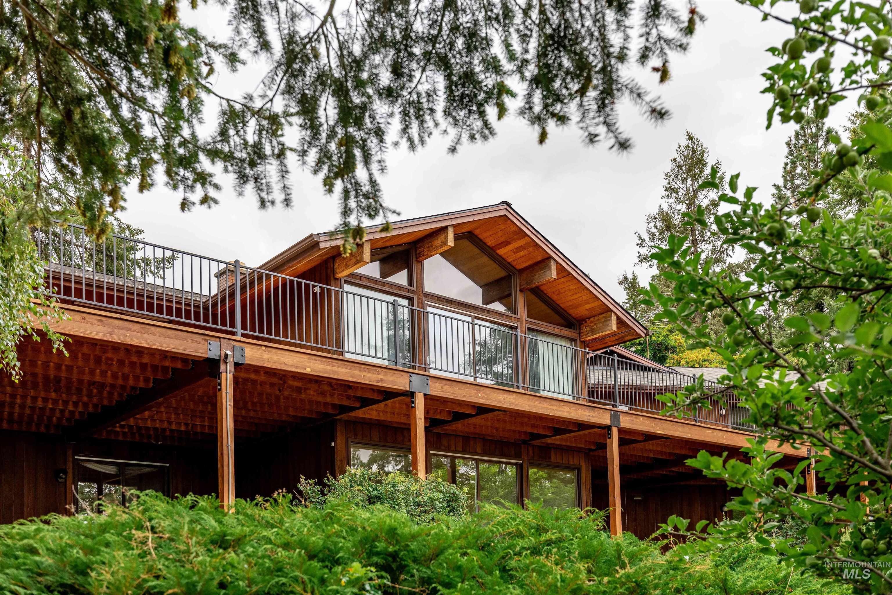 1050 Paradise Ridge Road Moscow, ID 83843 - Photo 3 of 49 Back of property with a wooden deck