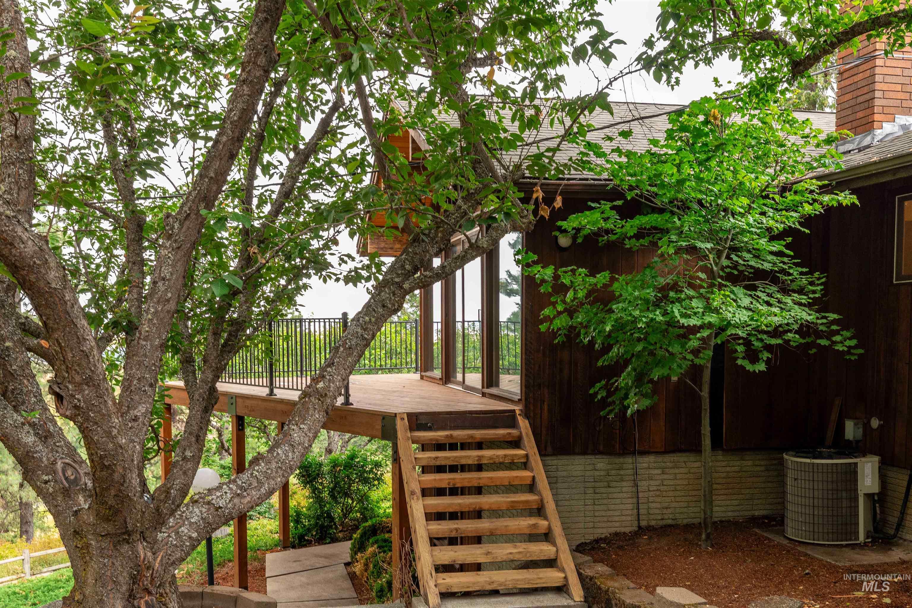 1050 Paradise Ridge Road Moscow, ID 83843 - Photo 40 of 49 View of jungle gym with stairs and a deck