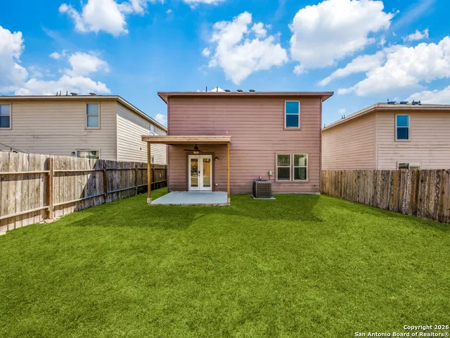 a backyard of a house with lots of green space
