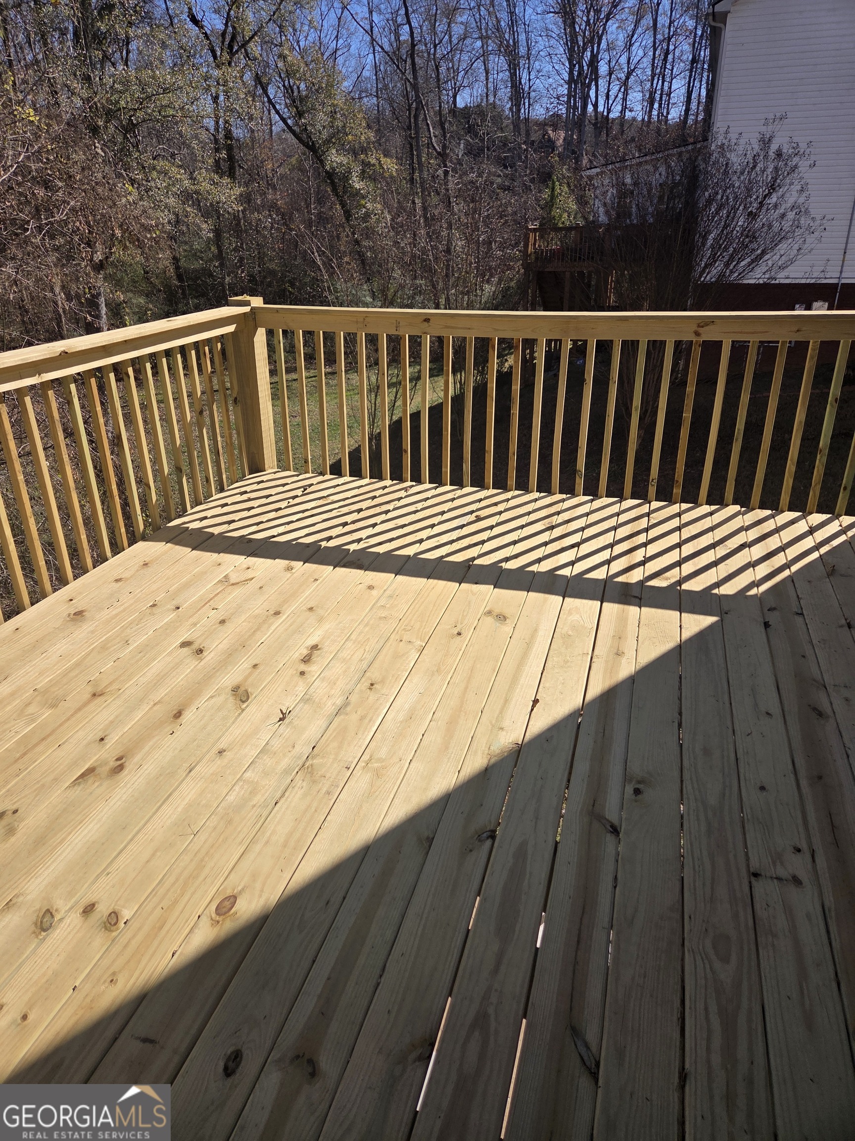 130 Stephanie Lane Covington, GA 30016 - Photo 14 of 18 a view of wooden deck
