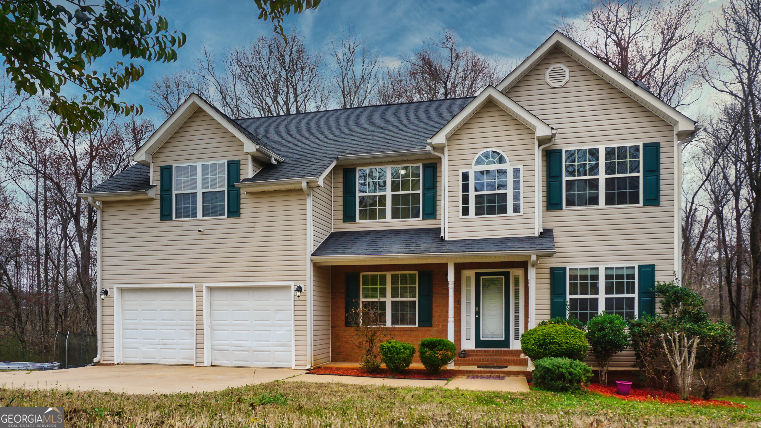 130 Stephanie Lane Covington, GA 30016 - Photo 2 of 67 a view of a house with small yard plants and plants