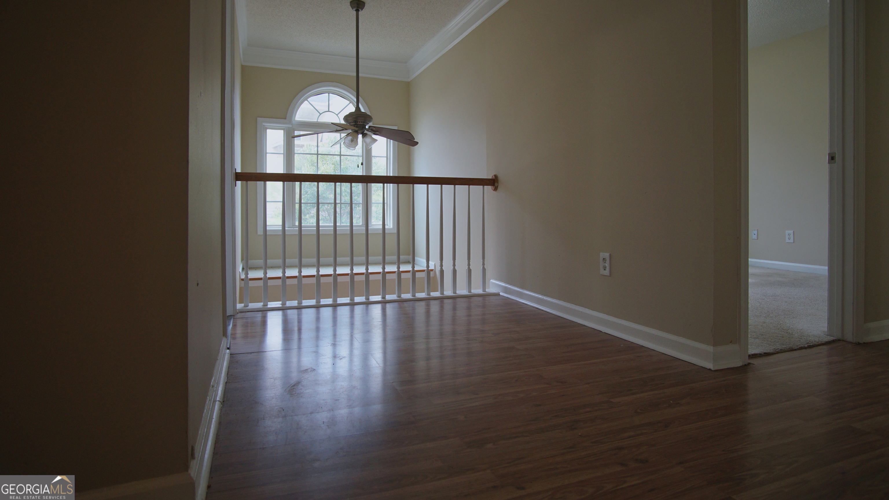 130 Stephanie Lane Covington, GA 30016 - Photo 46 of 67 a view of empty room with wooden floor and fan